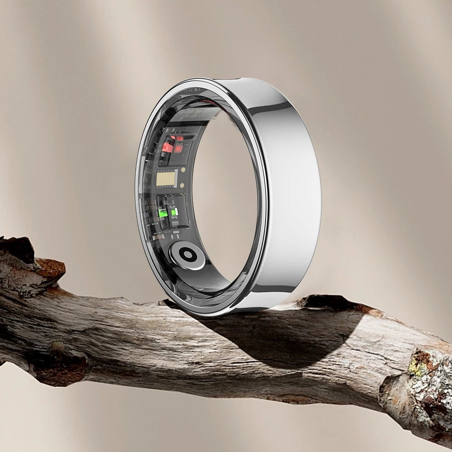 The Geep Ring, in silver, resting on driftwood